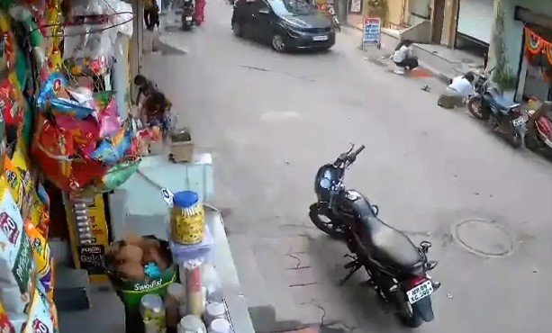 Speeding Car Runs Over Two Girls Making Rangoli