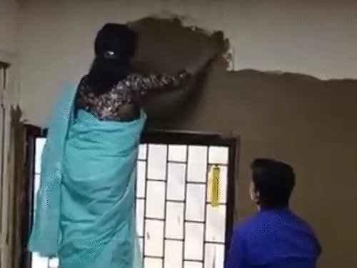 DU Principal Applies Cow Dung to Classroom for Cooling