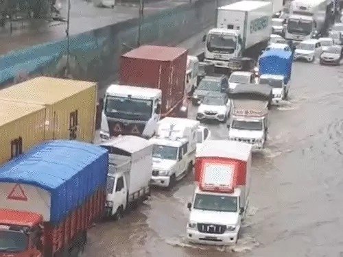 Mumbai Rain Chaos Flooded Roads Trains Halted Flights Late 